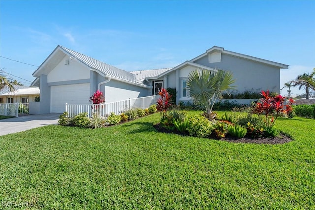 view of front of property featuring stucco siding, concrete driveway, a front lawn, and a garage