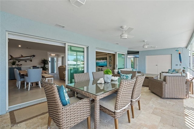 exterior space with outdoor dining area, visible vents, ceiling fan, and outdoor lounge area