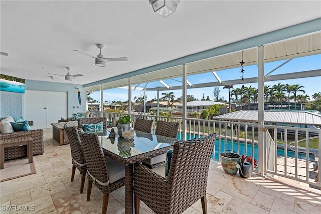 sunroom with visible vents and a ceiling fan