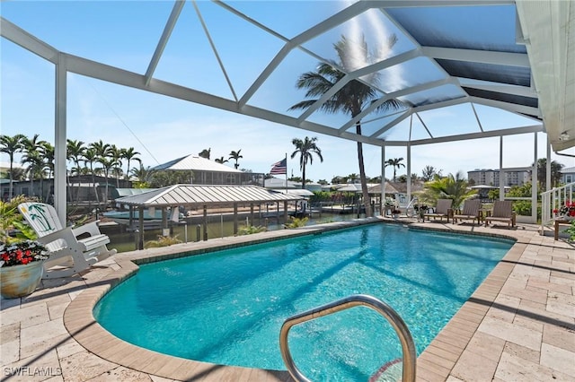 pool with a patio and a lanai