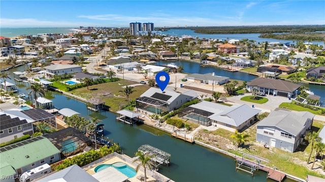 aerial view with a residential view and a water view