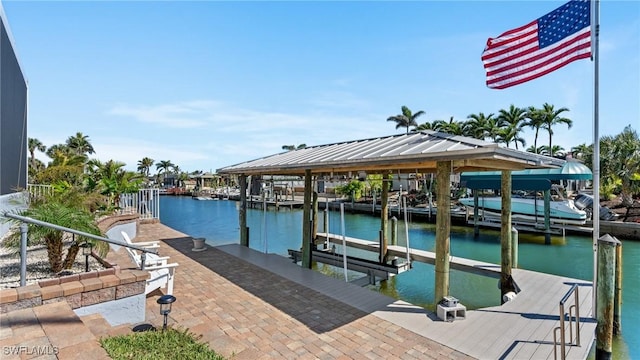 view of dock featuring boat lift and a water view