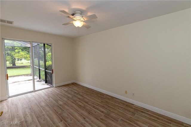 12391 Muddy Creek Ln, Fort Myers, FL 33913 - unfurnished room featuring ceiling fan, baseboards, and wood finished floors