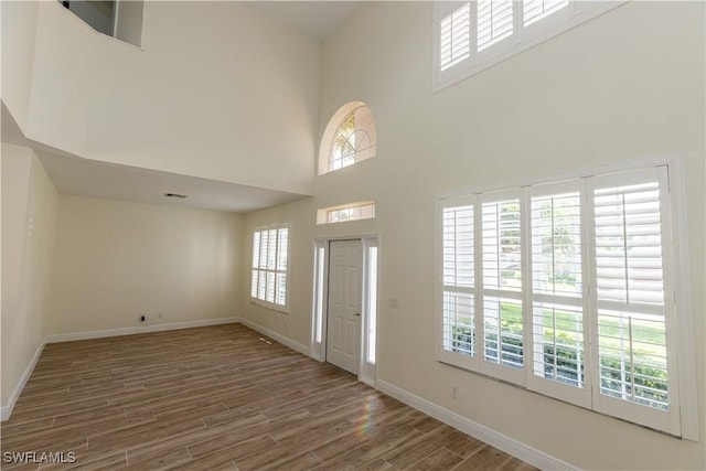 12391 Muddy Creek Ln, Fort Myers, FL 33913 - foyer entrance featuring a towering ceiling and wood finished floors