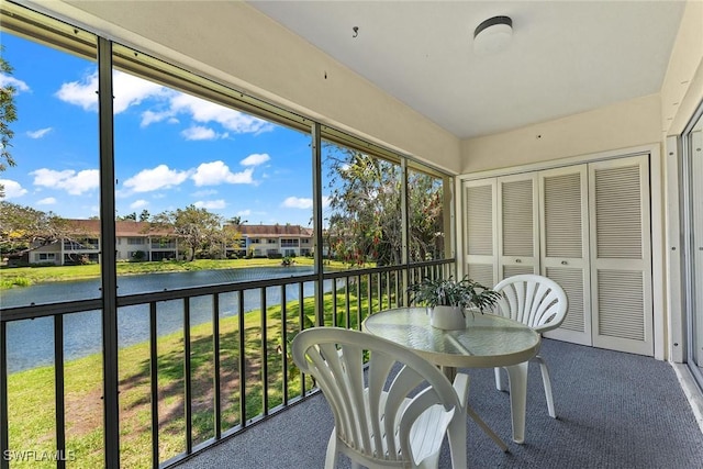 sunroom with a water view