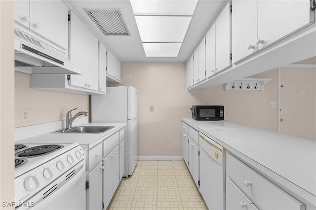 kitchen with visible vents, under cabinet range hood, white appliances, white cabinets, and light countertops