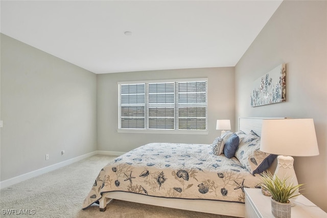 carpeted bedroom with baseboards
