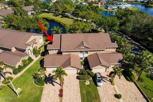 birds eye view of property featuring a residential view and a water view