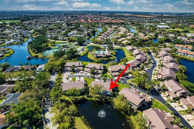 bird's eye view featuring a residential view and a water view