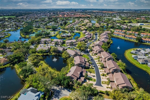 birds eye view of property with a residential view and a water view