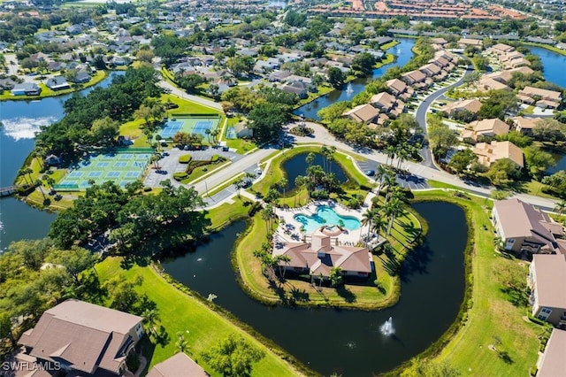 birds eye view of property with a residential view and a water view