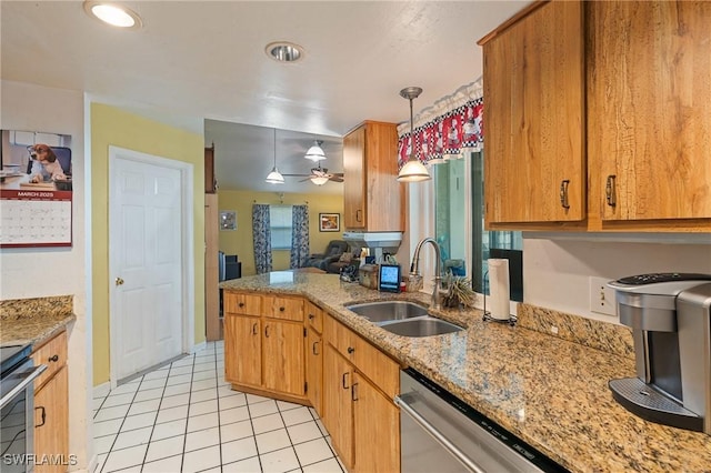 kitchen featuring light tile patterned floors, a ceiling fan, a sink, stainless steel dishwasher, and decorative light fixtures