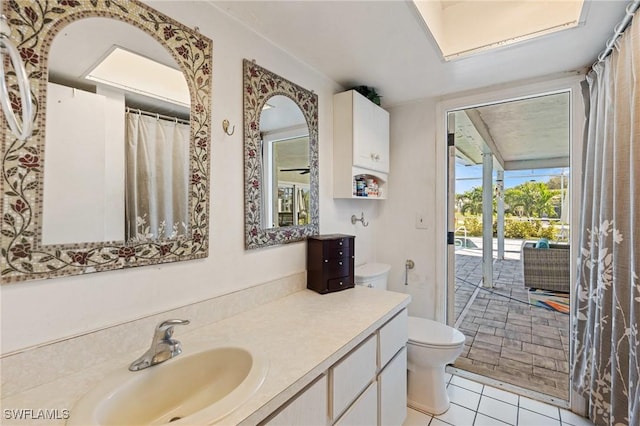 full bath featuring tile patterned flooring, toilet, and vanity