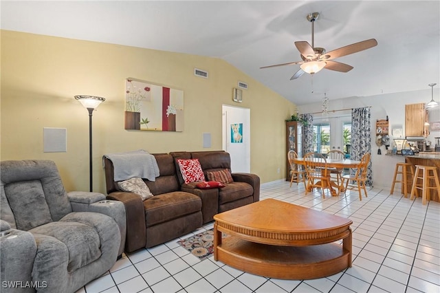 living area featuring visible vents, a ceiling fan, french doors, light tile patterned flooring, and lofted ceiling