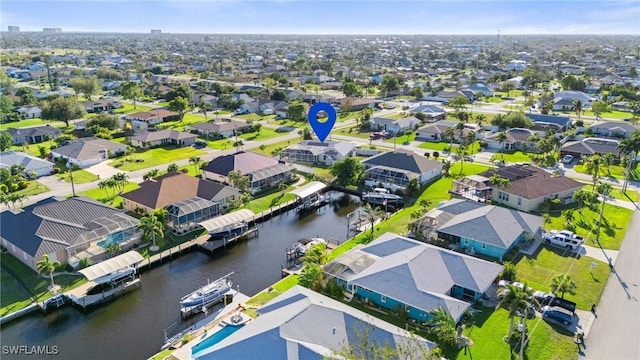 bird's eye view with a residential view and a water view