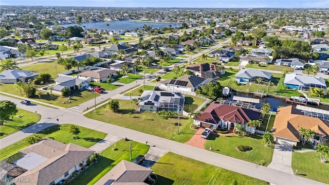 bird's eye view with a residential view and a water view