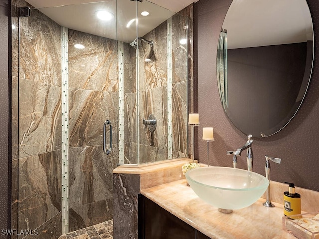 full bathroom featuring a shower stall and vanity