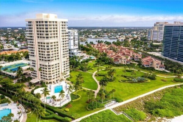 birds eye view of property with a city view and a water view
