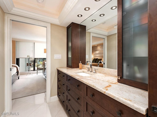 bathroom with tile patterned floors, connected bathroom, vanity, and crown molding