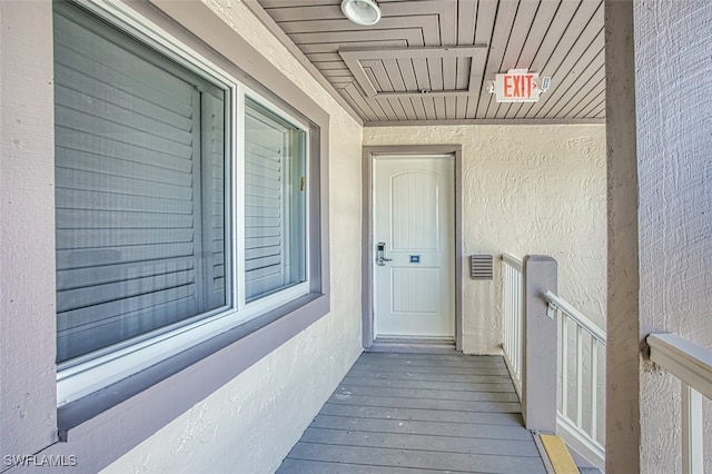 entrance to property with stucco siding