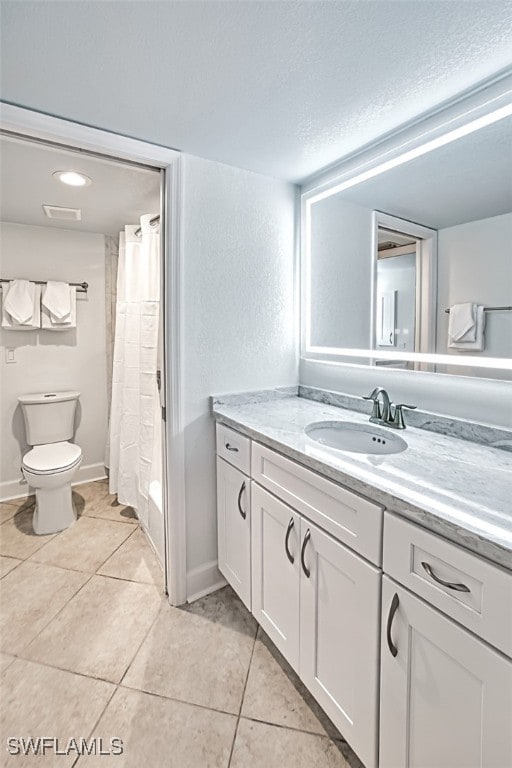 full bathroom featuring tile patterned flooring, visible vents, toilet, and vanity