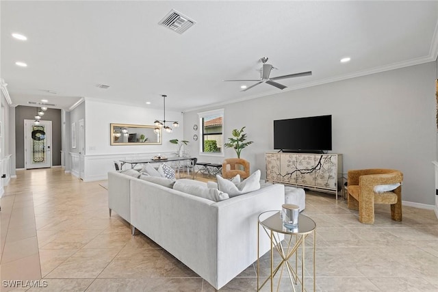 living room with visible vents, recessed lighting, and crown molding