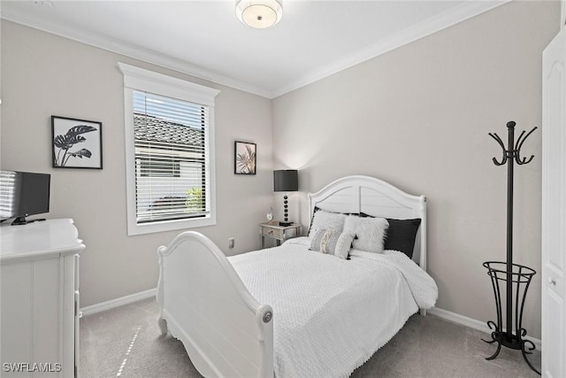 bedroom featuring baseboards, light carpet, and ornamental molding