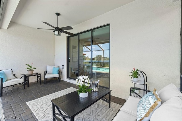 view of patio / terrace with an outdoor living space and ceiling fan