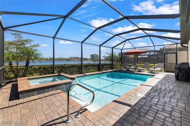 view of pool featuring a pool with connected hot tub, a water view, glass enclosure, area for grilling, and a patio