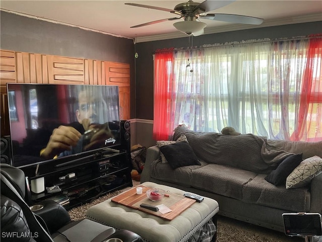 living room featuring crown molding and a ceiling fan