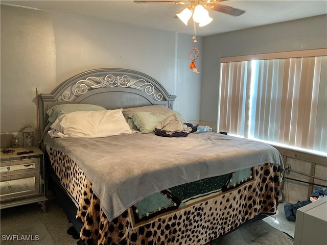 bedroom with multiple windows and ceiling fan