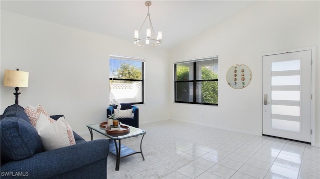 interior space featuring light tile patterned floors, an inviting chandelier, baseboards, and vaulted ceiling