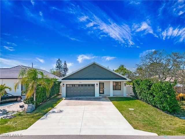 view of front of property featuring fence, a garage, stucco siding, a front yard, and driveway