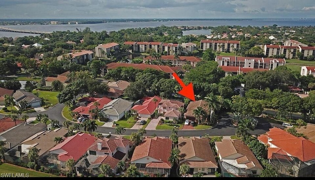 aerial view with a residential view and a water view