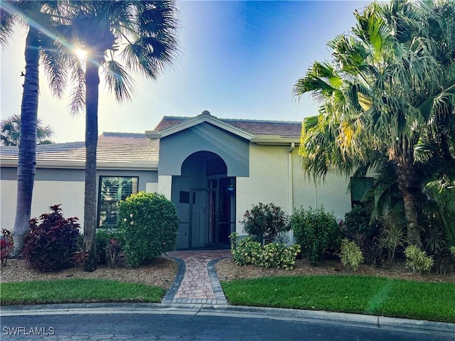 view of front of house featuring stucco siding