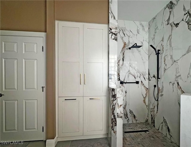 interior space featuring a marble finish shower