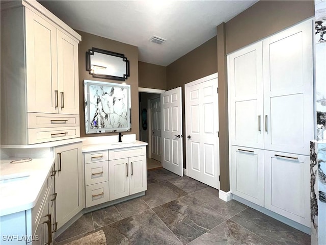 bathroom featuring visible vents and vanity