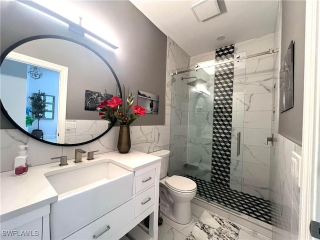 full bathroom with vanity, toilet, marble finish floor, and a stall shower