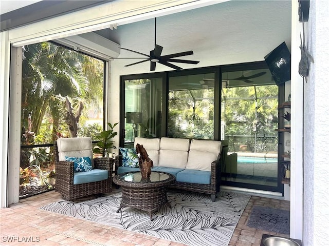 sunroom featuring ceiling fan