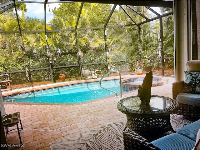 view of swimming pool with glass enclosure, a patio, and a pool with connected hot tub