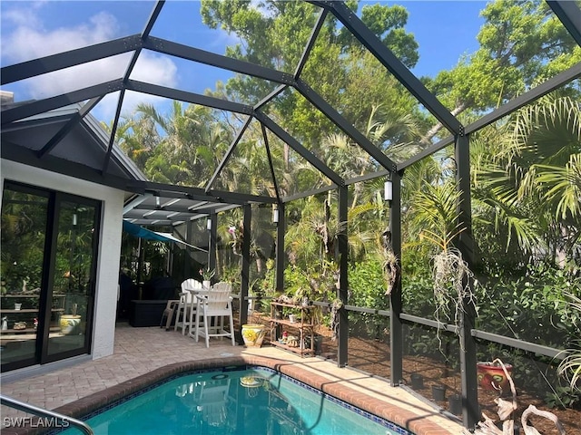 outdoor pool with a patio area