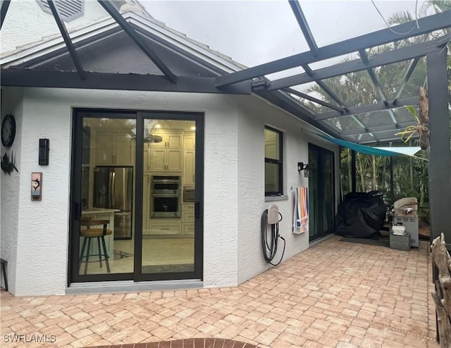 doorway to property with stucco siding