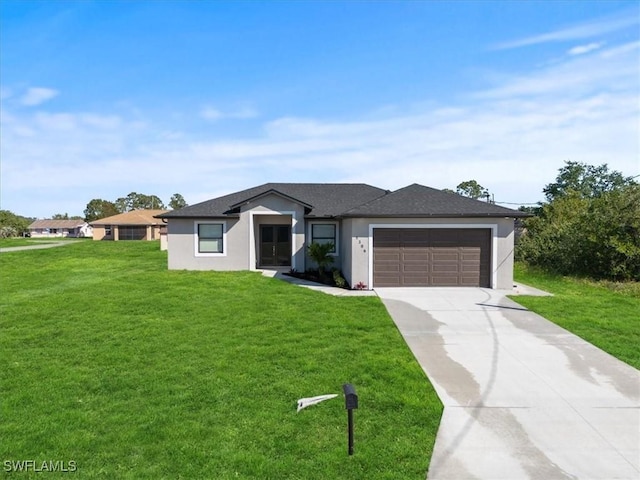 view of front of house featuring a garage, concrete driveway, a front lawn, and stucco siding