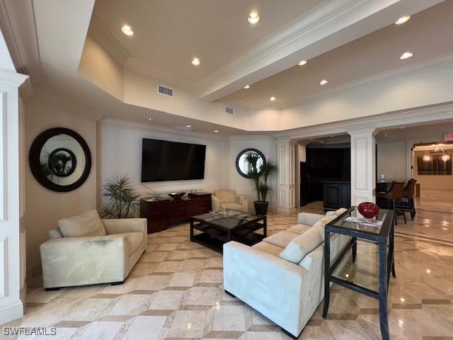 living room with decorative columns, recessed lighting, crown molding, and visible vents