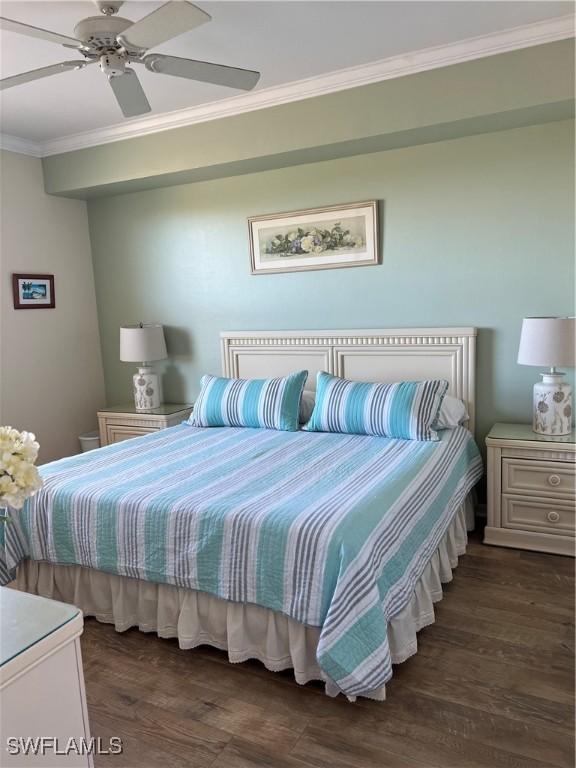 bedroom featuring wood finished floors, ceiling fan, and ornamental molding