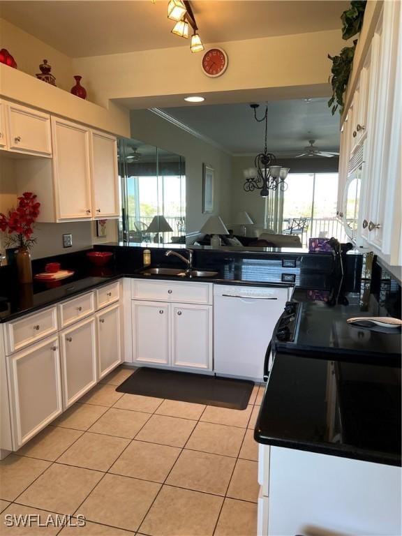 kitchen featuring a sink, white appliances, white cabinets, and light tile patterned floors