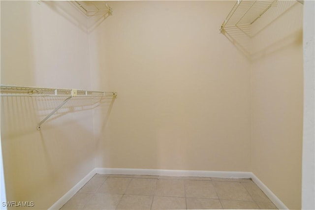 walk in closet featuring light tile patterned floors