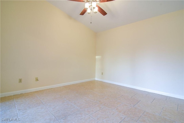 unfurnished room with light tile patterned floors, baseboards, ceiling fan, and vaulted ceiling