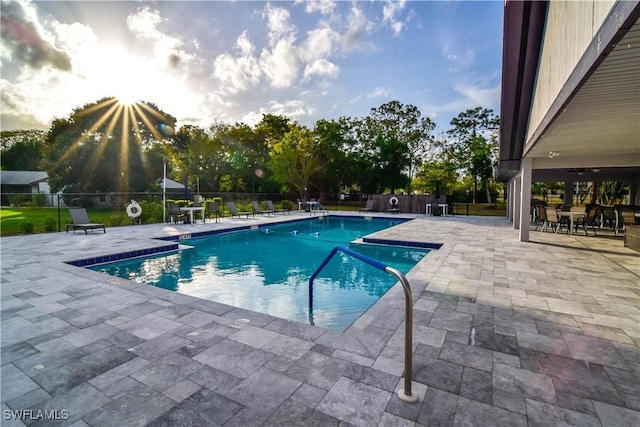 pool with fence and a patio area