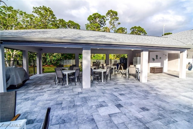 view of patio featuring outdoor dining space and a grill